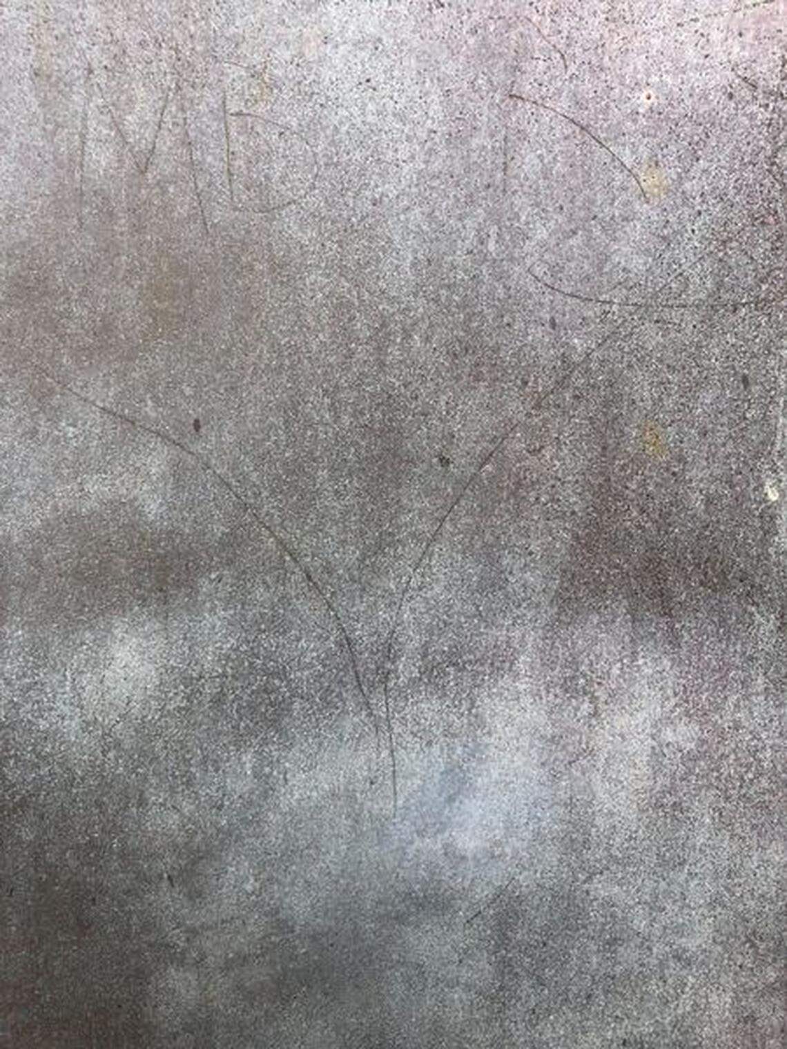 Vandals carved letters and shapes into the bronze door of the Cape Hatteras Lighthouse.