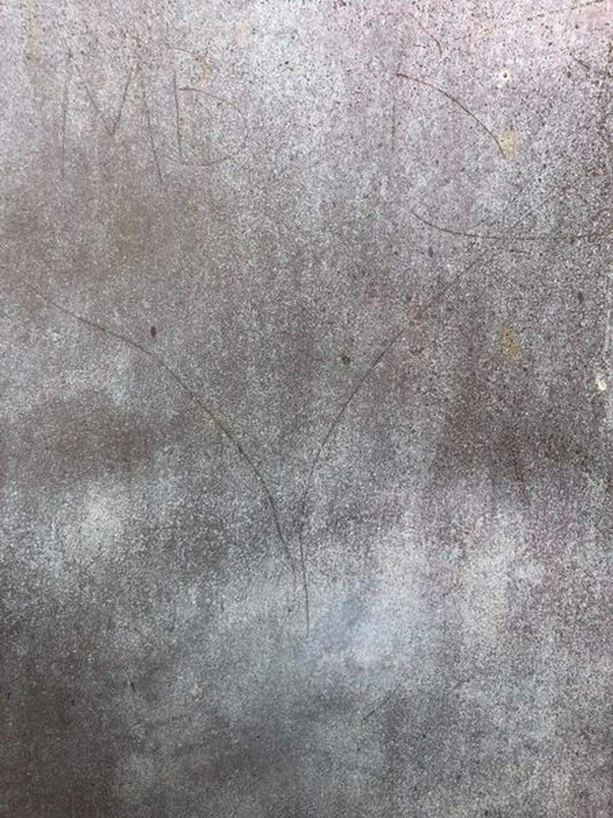 Vandals carved letters and shapes into the bronze door of the Cape Hatteras Lighthouse.