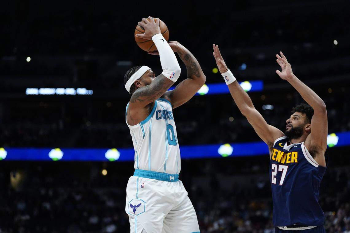 Denver Nuggets guard Jamal Murray (27) defends on Charlotte Hornets forward Miles Bridges (0) in the first quarter at Ball Arena.