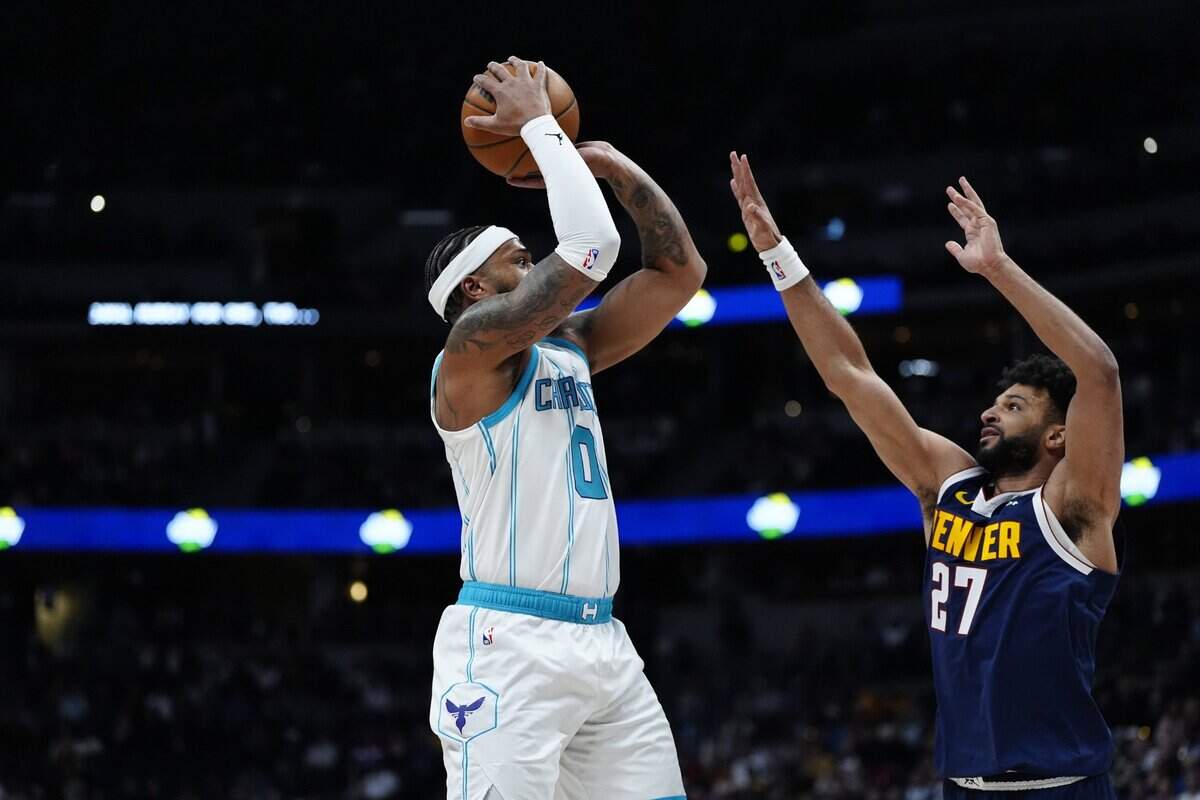 Denver Nuggets guard Jamal Murray (27) defends on Charlotte Hornets forward Miles Bridges (0) in the first quarter at Ball Arena.