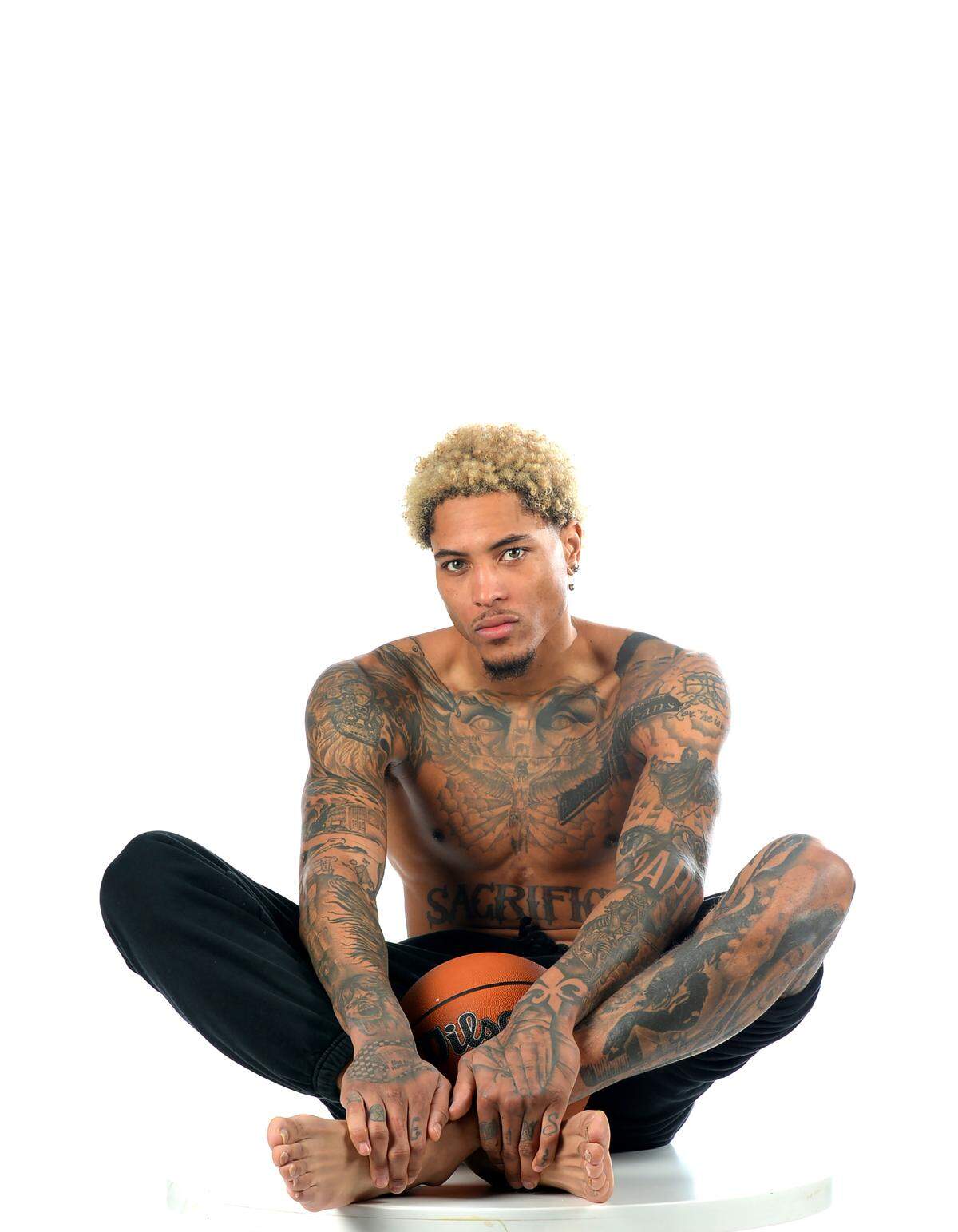 Charlotte Hornets forward/guard Kelly Oubre got his first tattoo when he was a sophomore in high school. OubreÕs first tattoo was a basketball with thorns around it. OubreÕs body is now tattooed with images of Jimi Hendrix, Michael Jackson and imagery of his birthplace New Orleans.