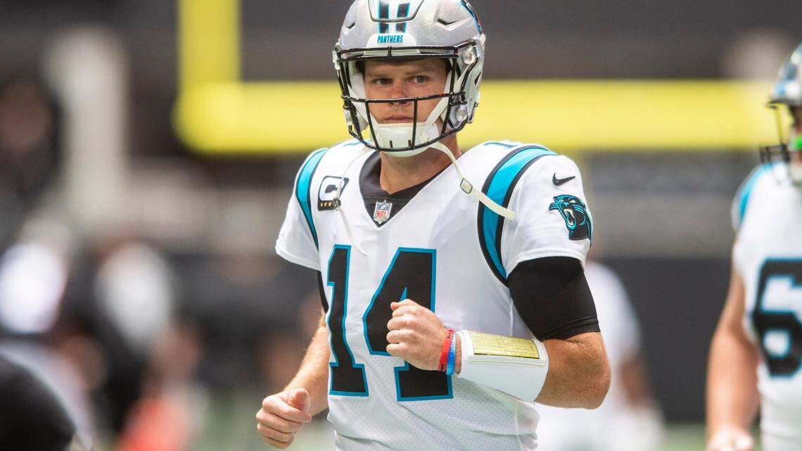 Panthers quarterback Sam Darnold enters the field for team warm-ups before the game against the Falcons at Mercedes-Benz Stadium on Sunday, October 31, 2021 in Atlanta, GA.