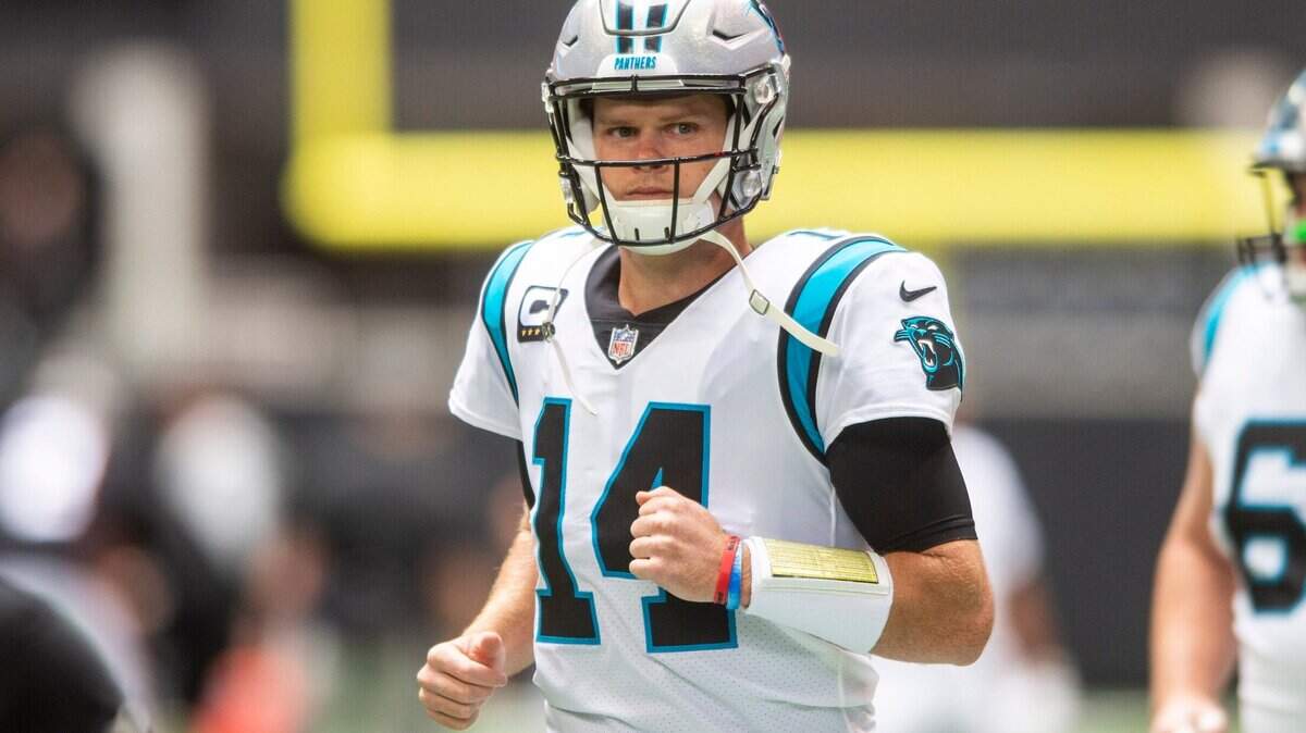 Panthers quarterback Sam Darnold enters the field for team warm-ups before the game against the Falcons at Mercedes-Benz Stadium on Sunday, October 31, 2021 in Atlanta, GA.