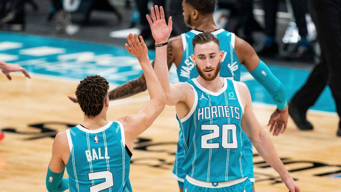 Charlotte Hornets forward Gordon Hayward (20) congratulates guard LaMelo Ball (2) Sunday. The two combined for 44 points in the Hornets’ 119-97 win over the Washington Wizards.