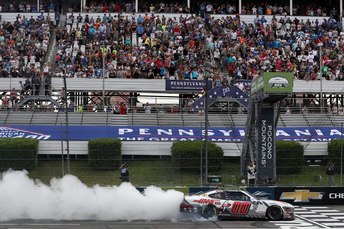 Jul 13, 2024; Long Pond, Pennsylvania, USA; NASCAR Xfinity Series driver Cole Custer (00) celebrates after winning the Explore The Pocono Mountains 225 at Pocono Raceway.