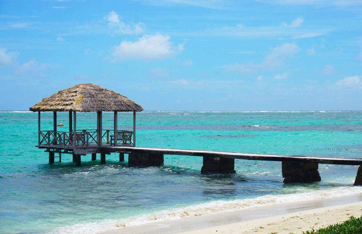 Thatched hut pier on Petit St. Vincent private island resort, St. Vincent and the Grenadines. American Airlines is starting service to St. Vincent and the Grenadines from Charlotte’s airport this December.