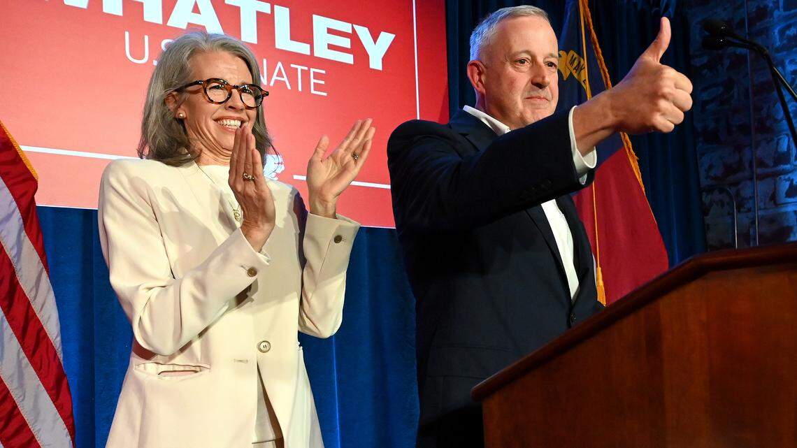 Suzanne Whatley, left, applauds as her husband, Michael Whatley, right, gives the thumbs up to supporters following his victory speech on Tuesday, March 3, 2026 at Noble Smoke in Charlotte, NC. Whatley won the Republican Party Primary for U.S. Senate.