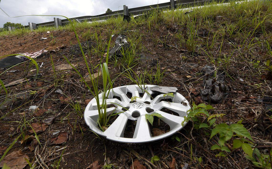 A hubcap is among the debris scattered along below a guardrail at the site where 6-year-old Liam Lagunas was fatally injured in June.