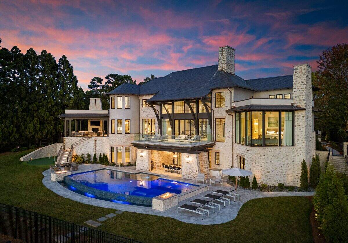Live a resort-style life outdoors, where a private gated yard features a hand-laid cobblestone driveway, saltwater infinity pool with a spa, and a firepit, fireplace and grilling patio.