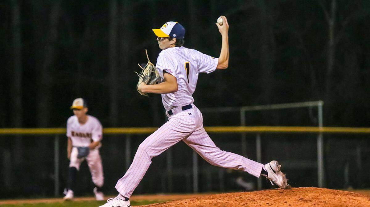 East Mecklenburg Pitcher Timon Strader strikes out Myers Park batter
