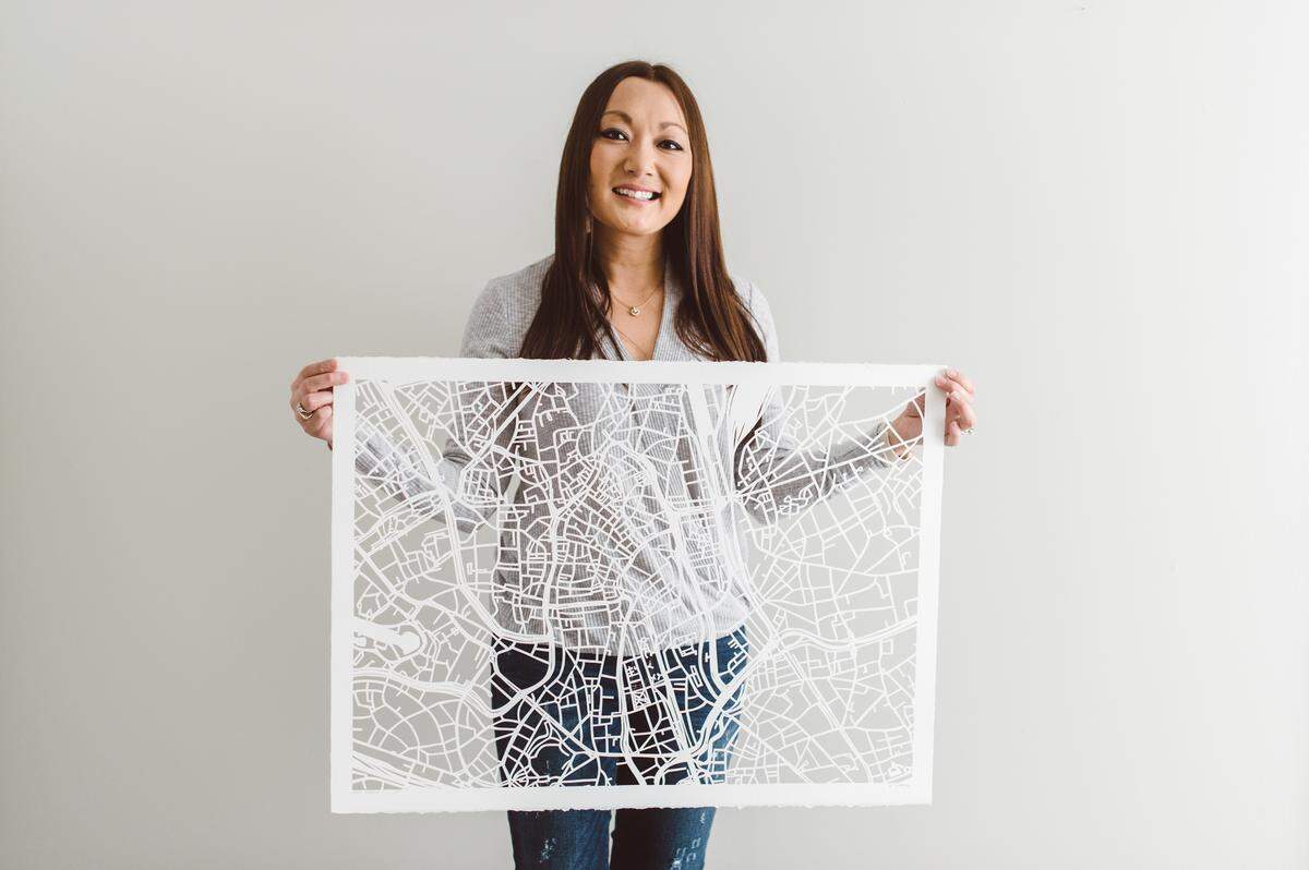 Karen O’Leary turned her architecture school thesis work into a business making intricate, hand-cut paper maps .