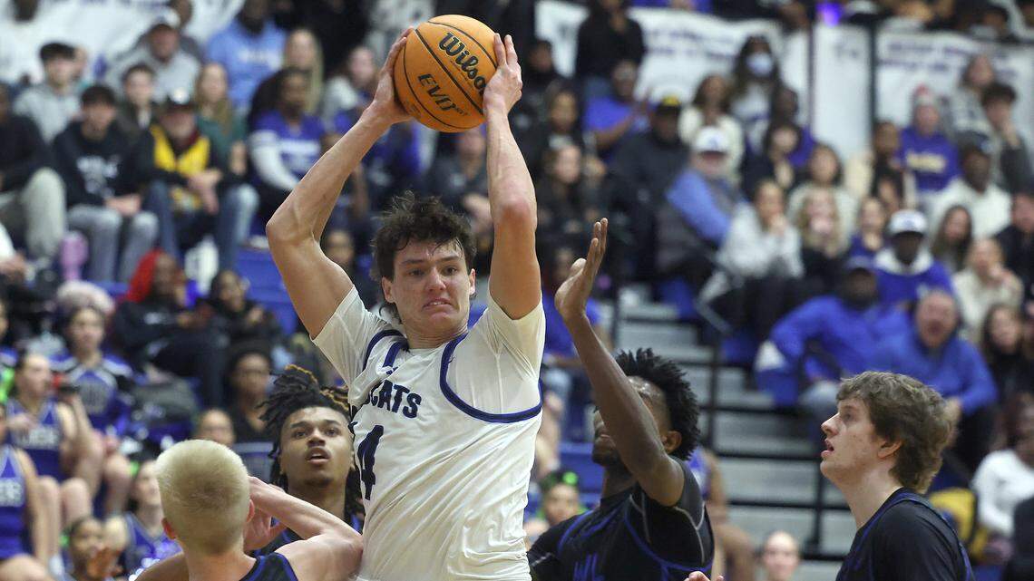 Lake Norman’s Trent Steinour, center, fights to get position to move toward the basket during action against Mooresville on Wednesday, January 22, 2025 at Lake Norman High School. Lake Norman defeated Mooresville 99-71.