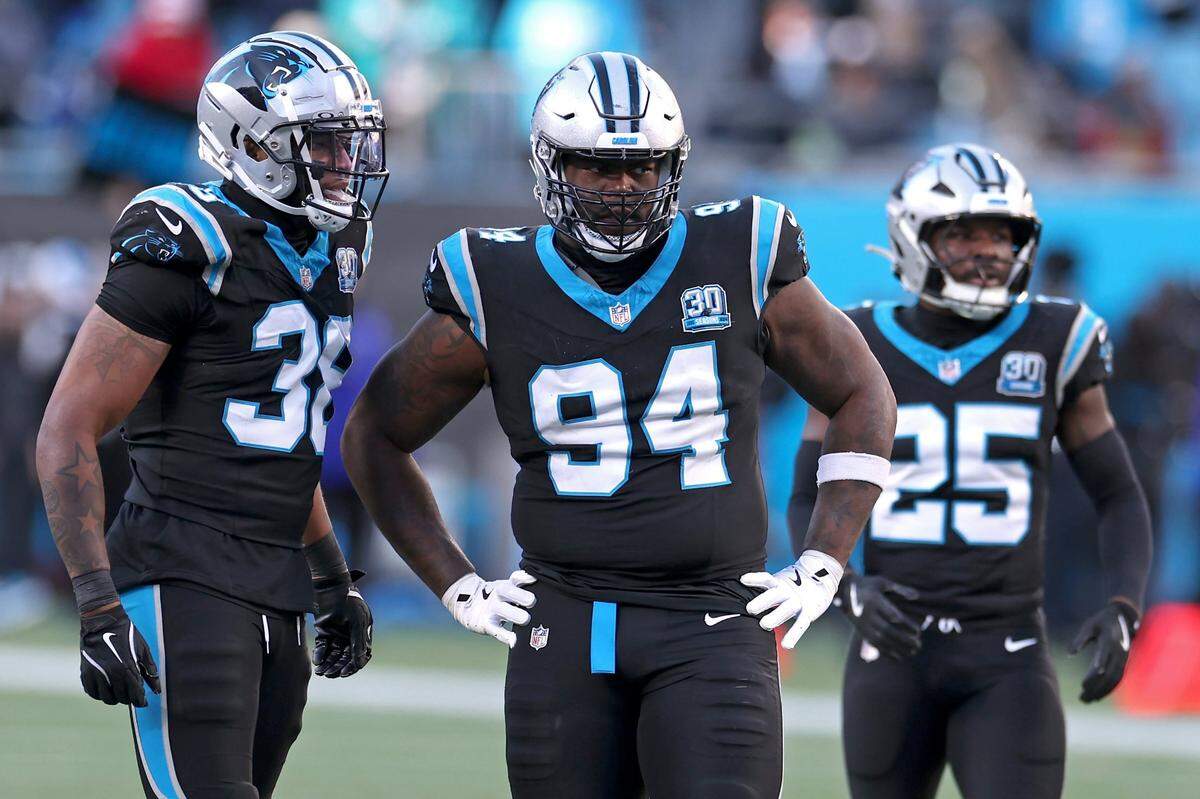 Carolina Panthers defensive end A’Shawn Robinson, center, waits to line up against the Arizona Cardinals offense during action at Bank of America Stadium in Charlotte, NC on Sunday, December 22, 2024. The Panthers defeated the Cardinals 36-30 in overtime.