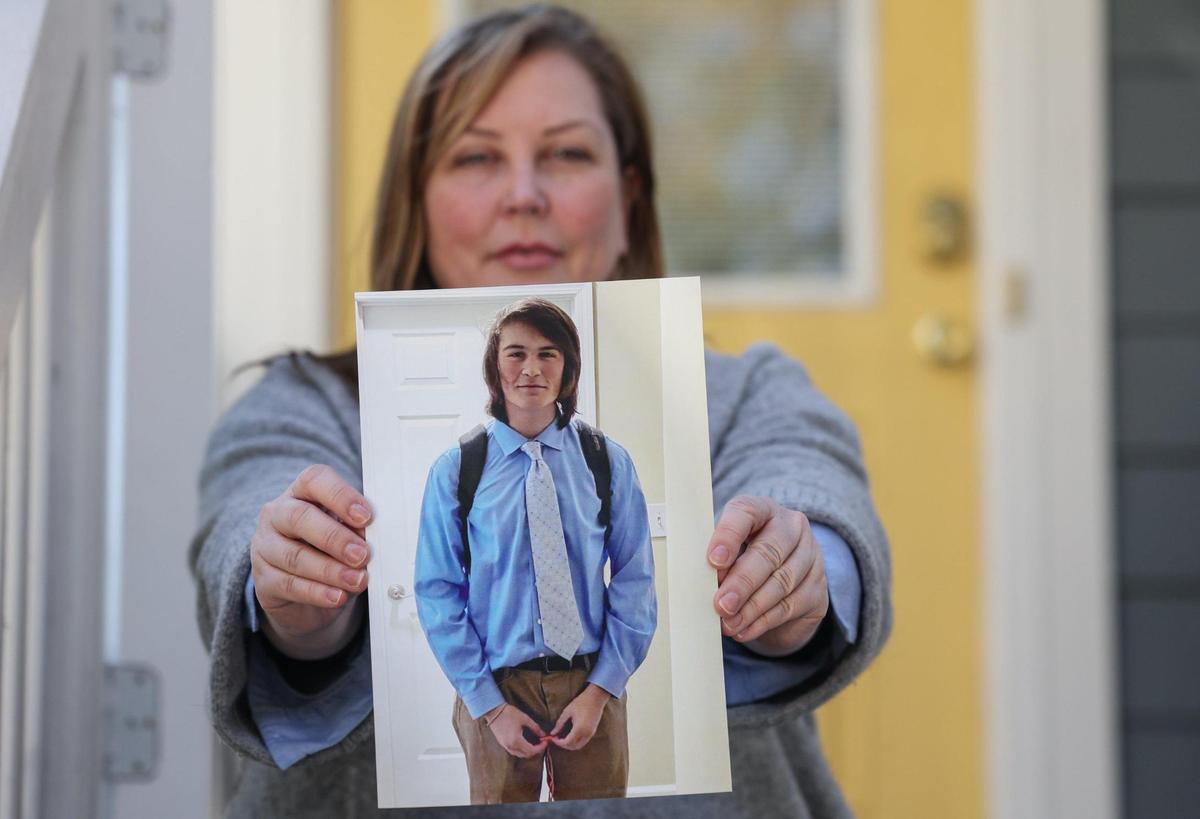 Gwyneth Brown holds a photo of her son, Laird Ramirez, a 17-year-old Mecklenburg highschoolerwho died last July after taking a pressed pill that disguised fentanyl as a Percocet, his parents said.
