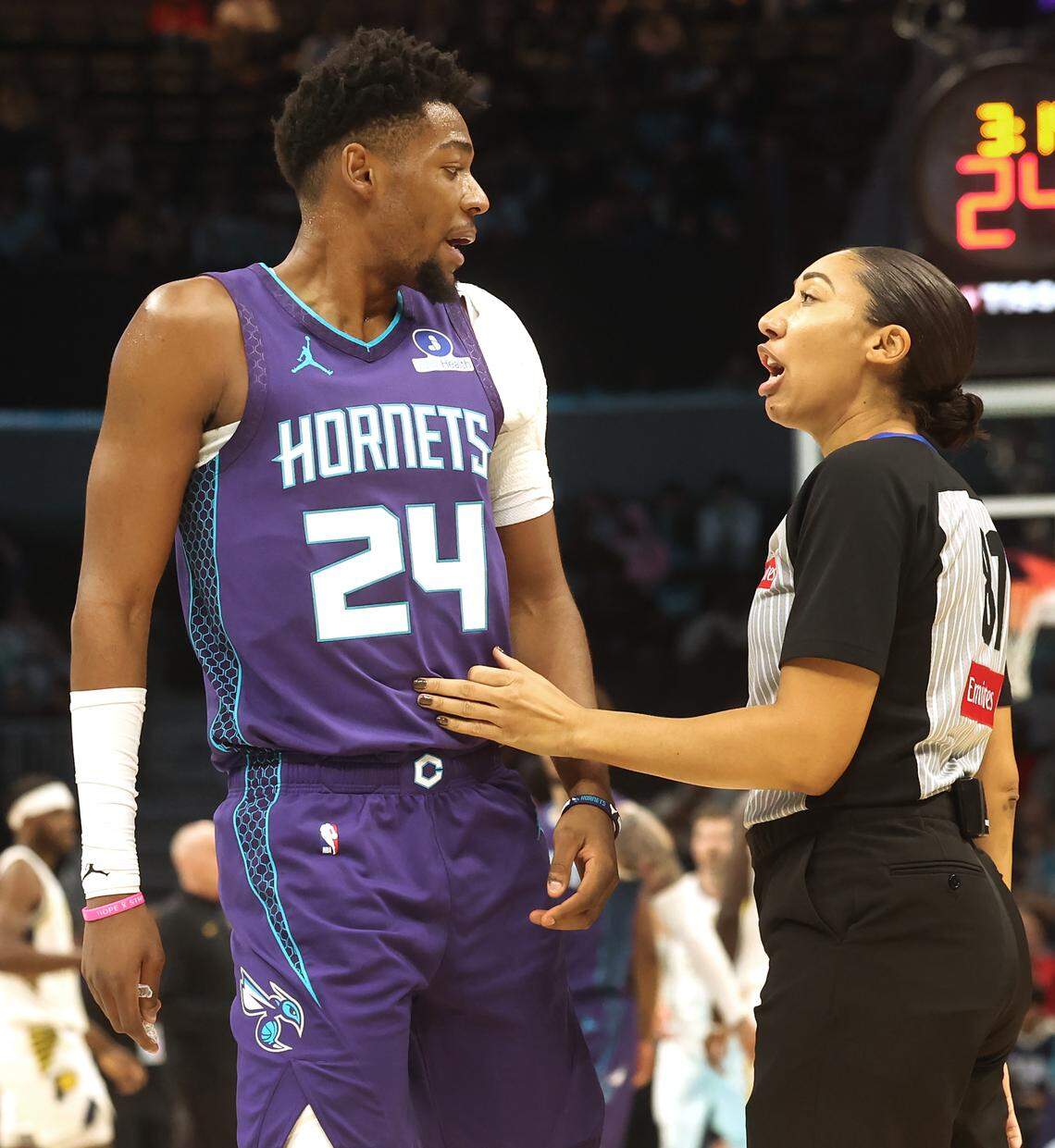 Charlotte Hornets guard Brandon Miller, left, discusses a foul call with umpire Simone Jelks during the team’s game against the Indiana Pacers at Spectrum Center in Charlotte, N.C. on Thursday, January 8, 2026. 