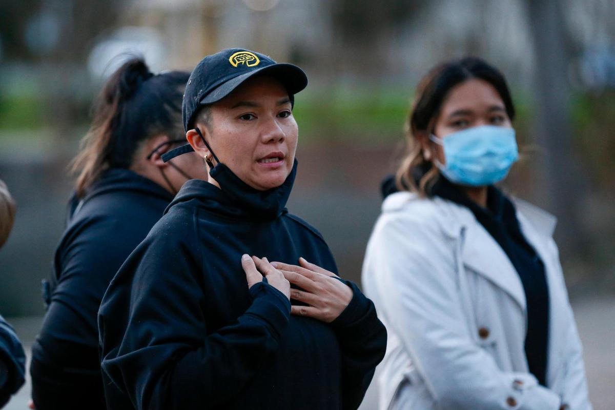 Cat Le of the social justice group SEAC Village speaks during the Asian Solidarity Candlelight Vigil at Marshall Park in Charlotte, N.C., on Sunday, March 21, 2021.