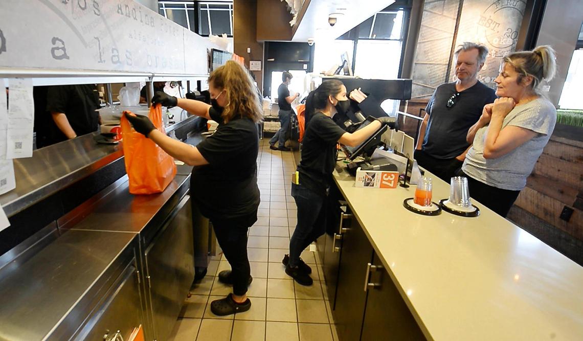 Viva Chicken Waverly employees fill orders May 14. Viva Chicken, a fast-casual Peruvian rotisserie chain, is offering a sign-on hiring bonus at its 12 Charlotte-area locations amid a nationwide worker shortage.