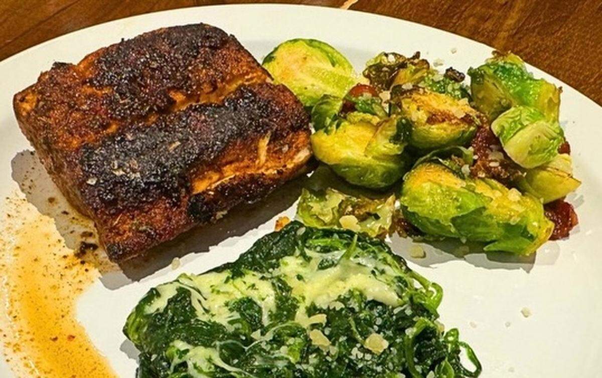 Salmon, creamed spinach and Brussels sprouts at Beef & Brine Steakhouse Tavern in Concord.