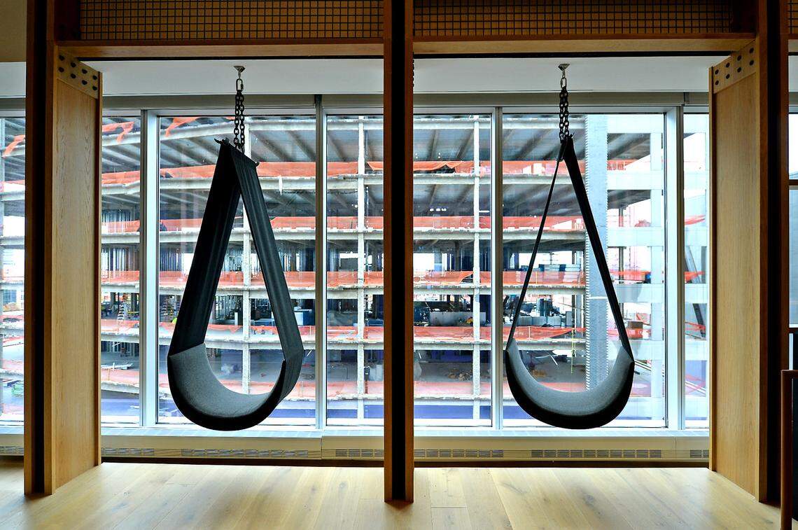 A pair of swing chairs are available for employees to relax in at the town hall area of LendingTree headquarters in South End.