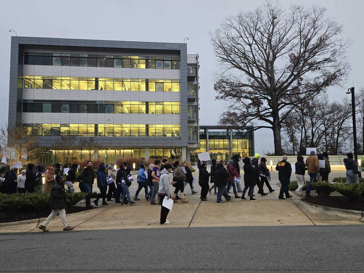 Corning workers and supporters rally outside of Corning’s headquarters in Charlotte. The United Steelworkers organization is trying to organize unions throughout the state.