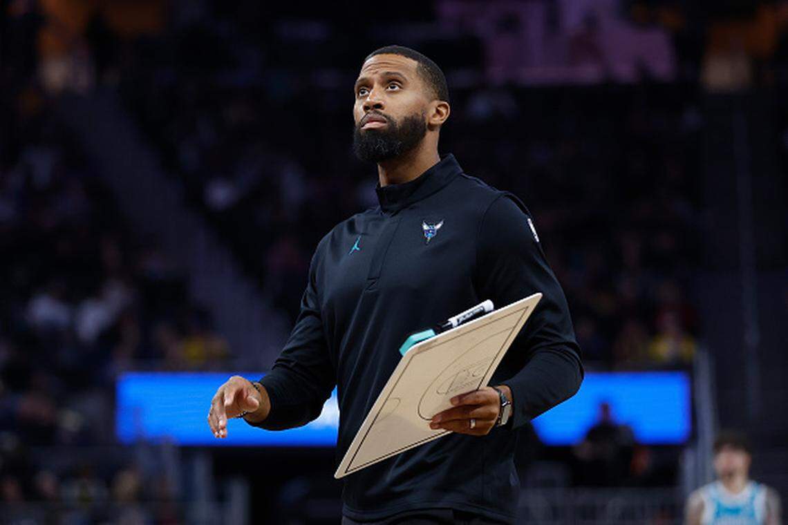 Head coach Charles Lee of the Charlotte Hornets looks on during a timeout against the Golden State Warriors at Chase Center.