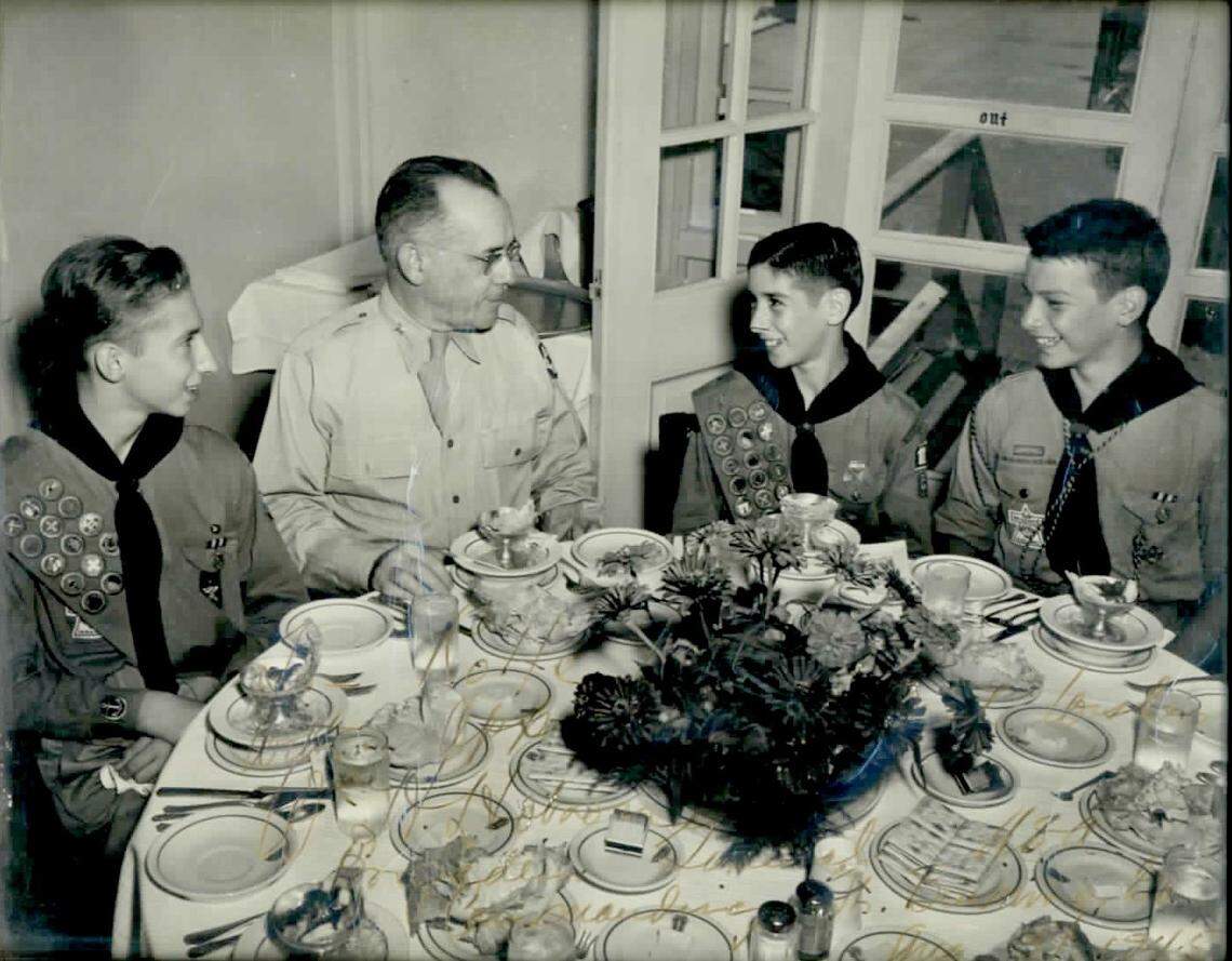 Former Charlotte Observer Publisher Rolfe Neill, right, was a Boy Scout. Starting at age 10, Neill rose daily at 5 a.m. to deliver the Columbus Enquirer, a $12-a-week job he would keep until high school graduation. 