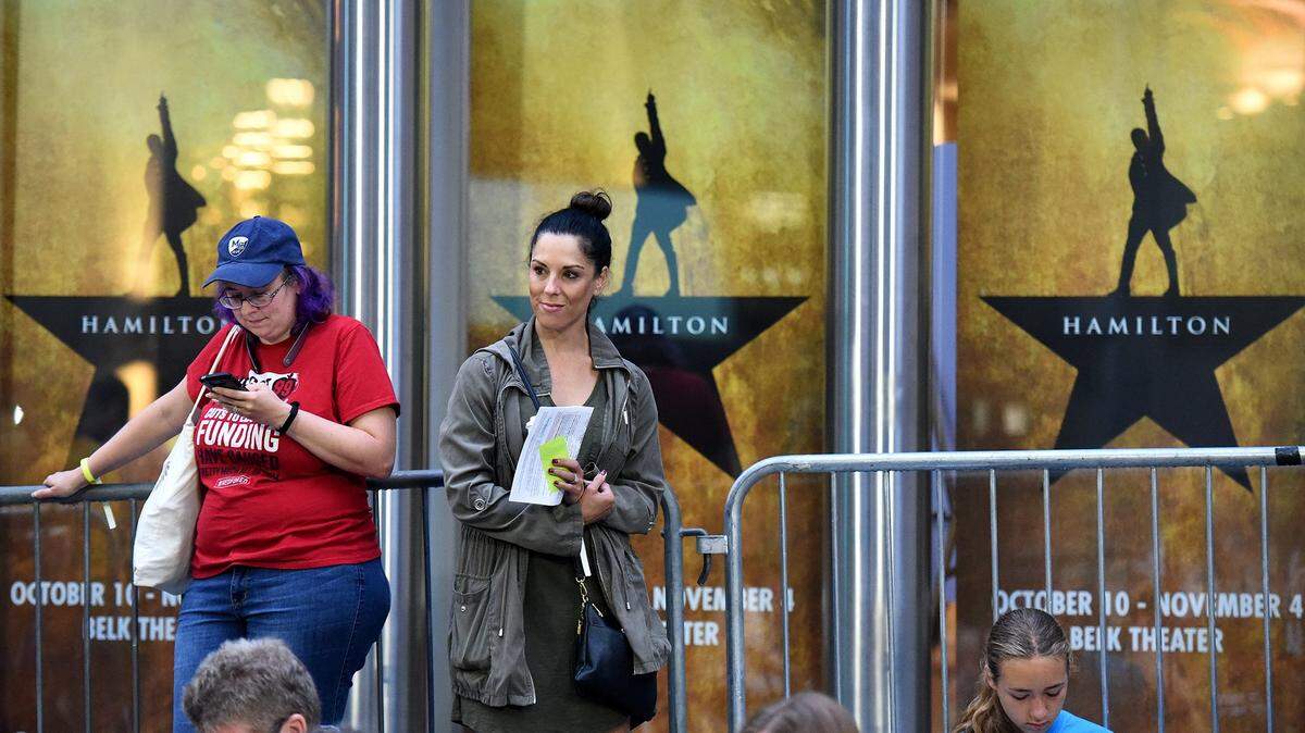 Bethany Dykstra of Charlotte and Christine Smith-Barker of Davidson wait outside Belk Theater on Aug. 1, when tickets went on sale for the national tour of Broadway’s “Hamilton.” “Hamilton” will come to the Durham Performing Arts Center Nov. 6-Dec. 2.