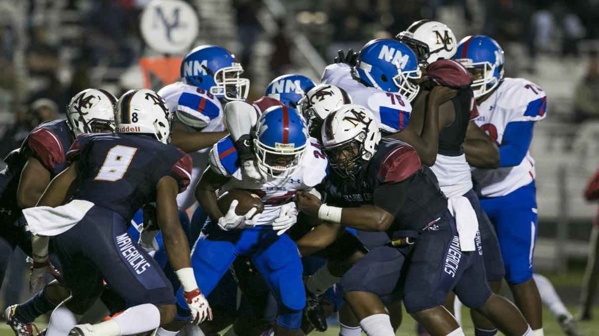 North Meck ball carrier Michael Ward gets stopped by the Mallard Creek defense during a prep football game Friday, October 20, 2017. Mallard Creek won then, but the teams meet in a second round playoff Friday
