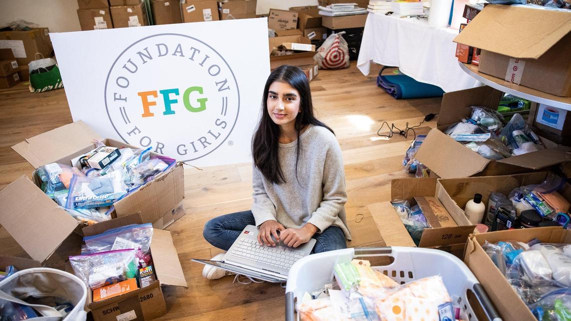 Sahana Mantha poses for a portrait with materials for her nonprofit, Foundation For Girls, in Charlotte, N.C., on Monday, March 28, 2022.