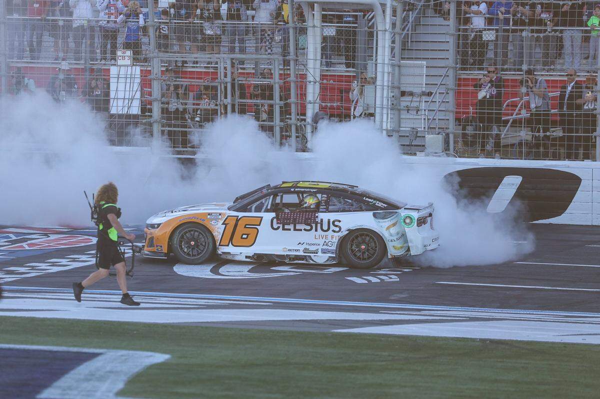 AJ Allmendinger spins out on the track after winning the Bank of America Roval 400 at Charlotte Motor Speedway on Sunday.
