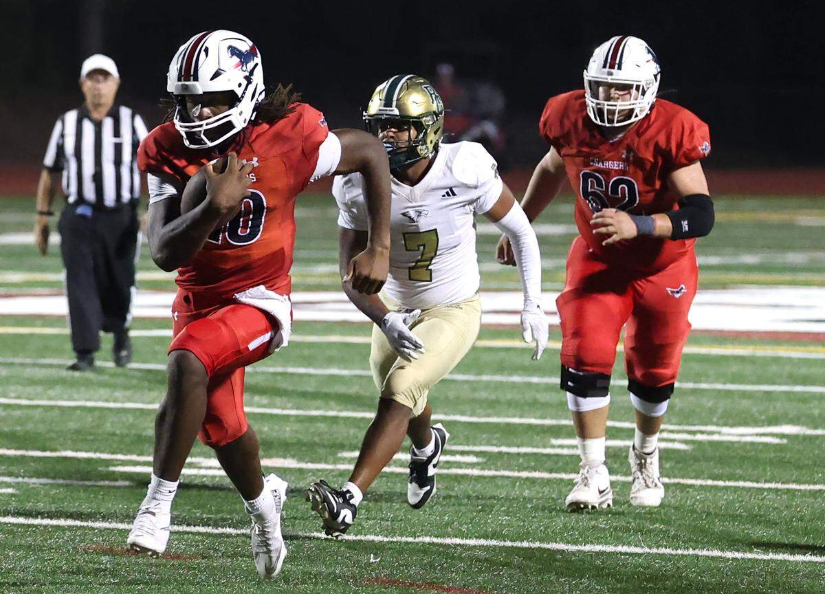 Providence Day Chargers quarterback Zaid Lott breaks into the open field on a touchdown run against Rabun Gap on Friday, September 19, 2025. Providence Day defeated Rabun Gap 55-34.