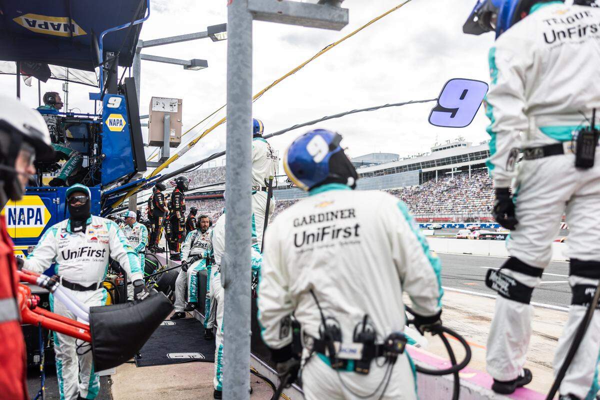 Pit crews wait for their drivers at the Bank of America Roval 400 on Oct. 5, 2025, at Charlotte Motor Speedway.
