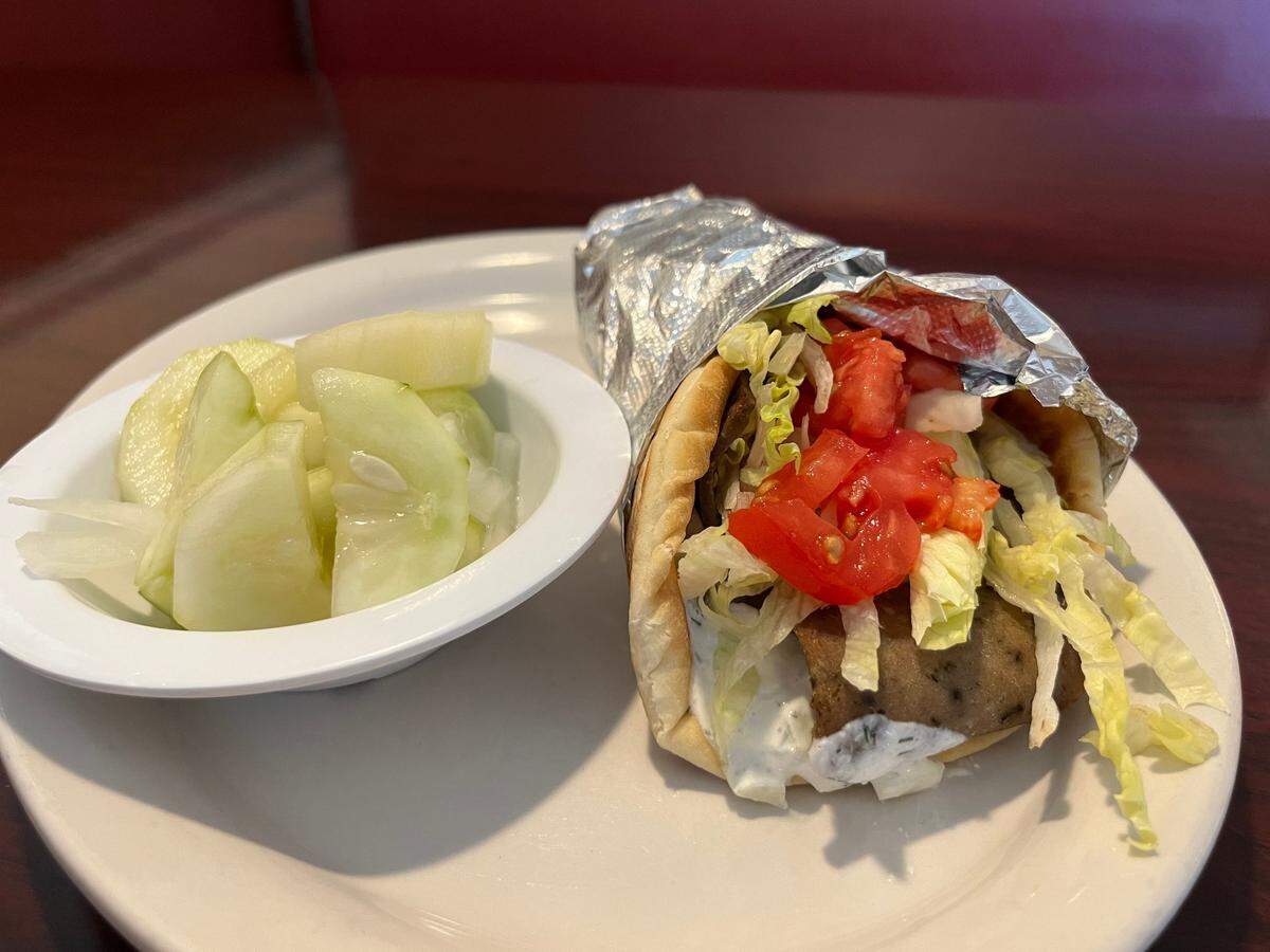 A gyro and cucumber and onion salad at Miki’s Restaurant in Matthews.