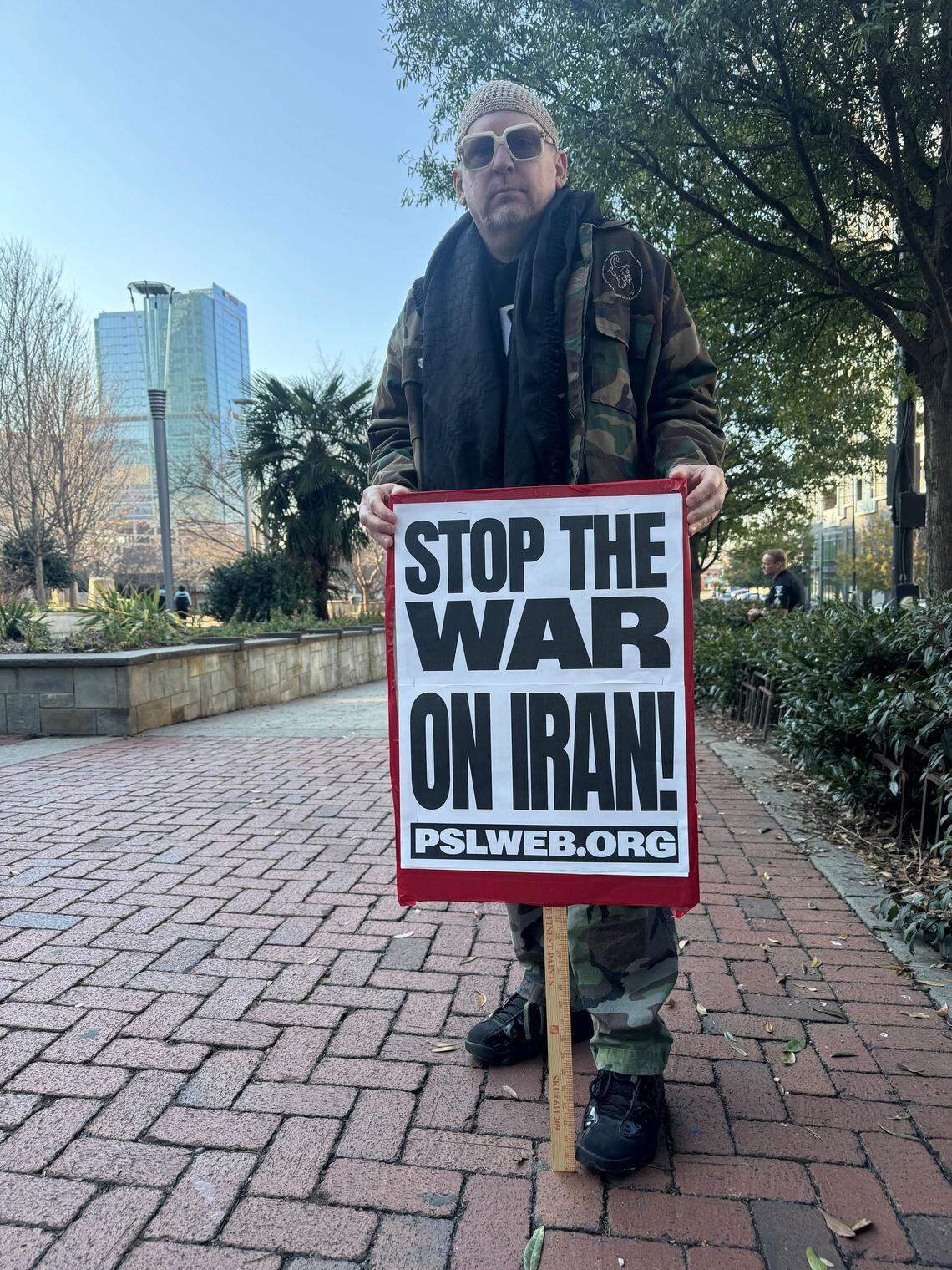 Jibril Hough of the Islamic Center of Charlotte marched in a protest against U.S. involvement in the attack on Iran on Saturday, Feb. 28, 2026.