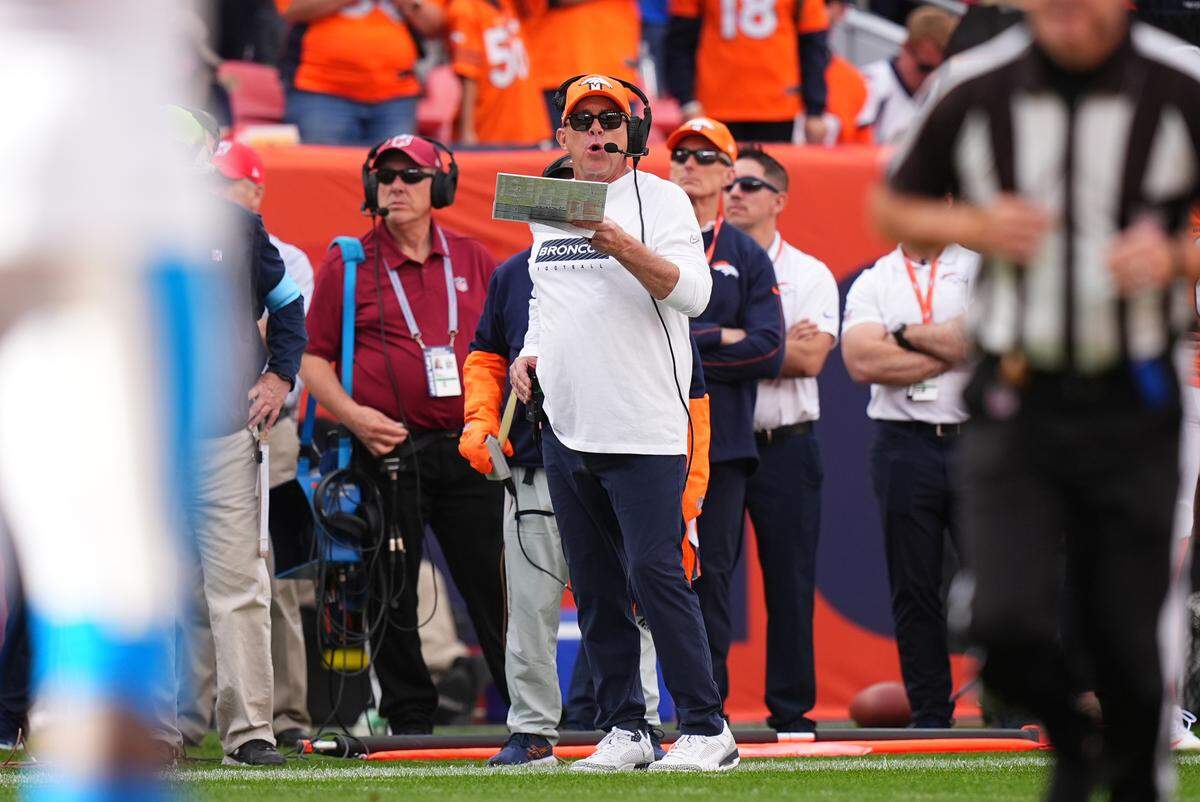 Denver Broncos head coach Sean Payton calls plays during the second quarter against the Carolina Panthers at Empower Field at Mile High.