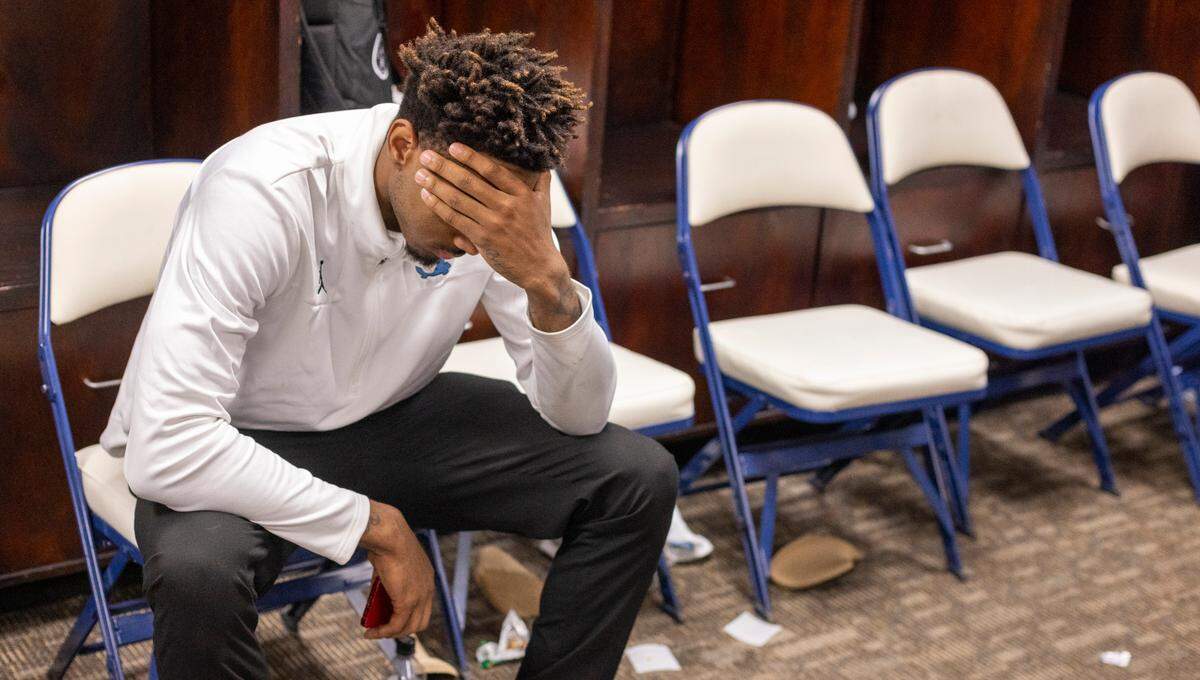 North Carolina’s Leaky Black (1) gathers his thoughts in the locker room following the Tar Heels’ 68-59 loss to Virginia. “I really feel kind of numb,” Black said.