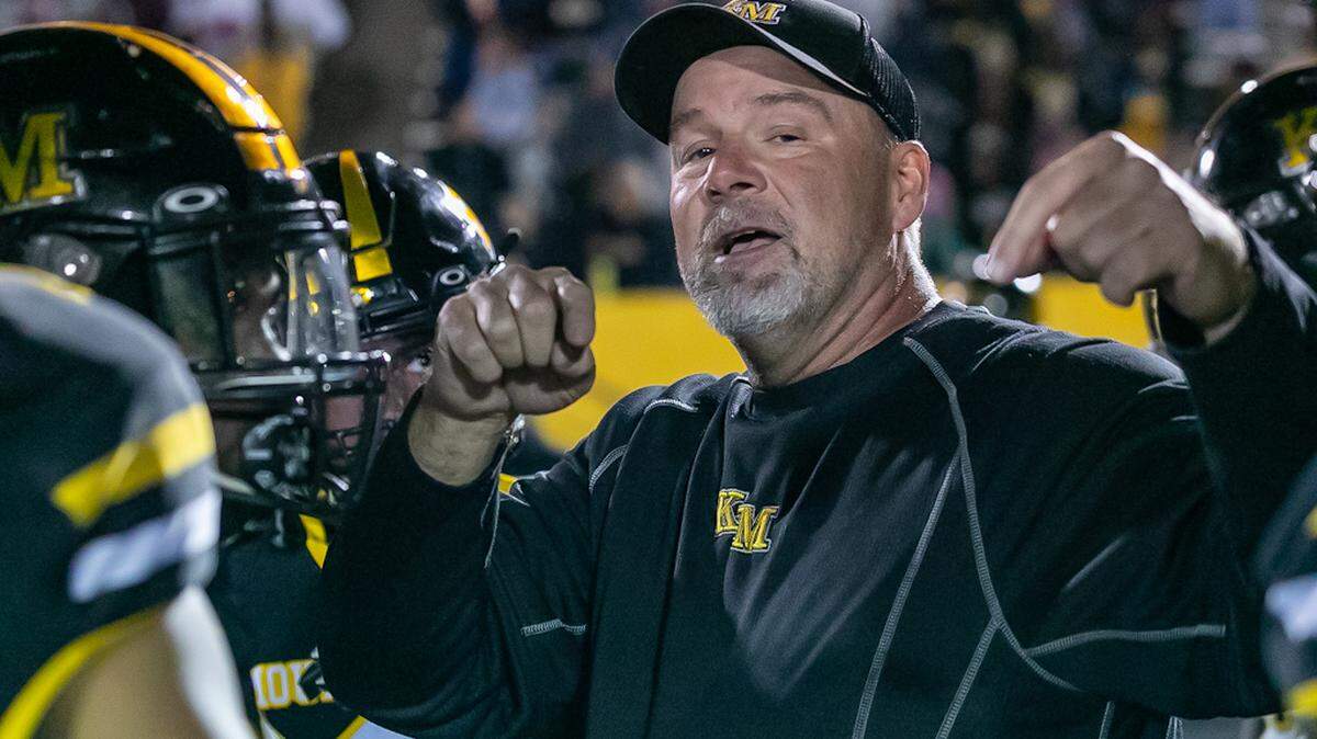 Kings Mountain Coach gives his team a pep talk during a time oit.