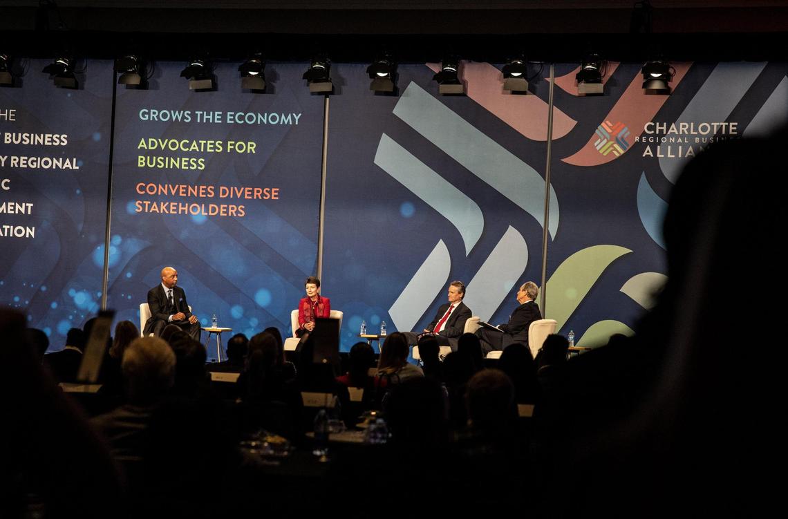Marvin Ellison (left), Lynn Good, Brian Moynihan and moderator Chris William speak during the Charlotte Regional Buisness Alliance Annual Economic Outlook event in Charlotte, N.C., on Wednesday, December 8, 2021.