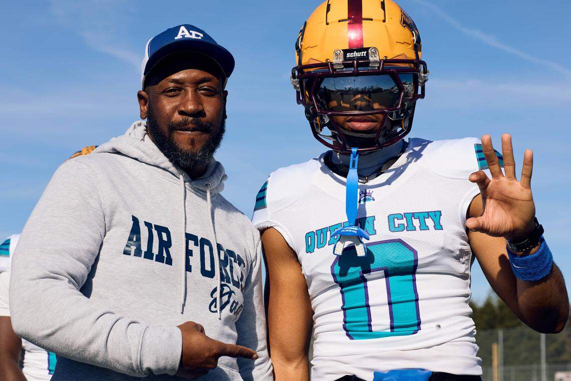 West Charlotte WR Rakim Finch (0) poses with their family prior to the start of the Queen City Senior Bowl hosted at Olympic High School.