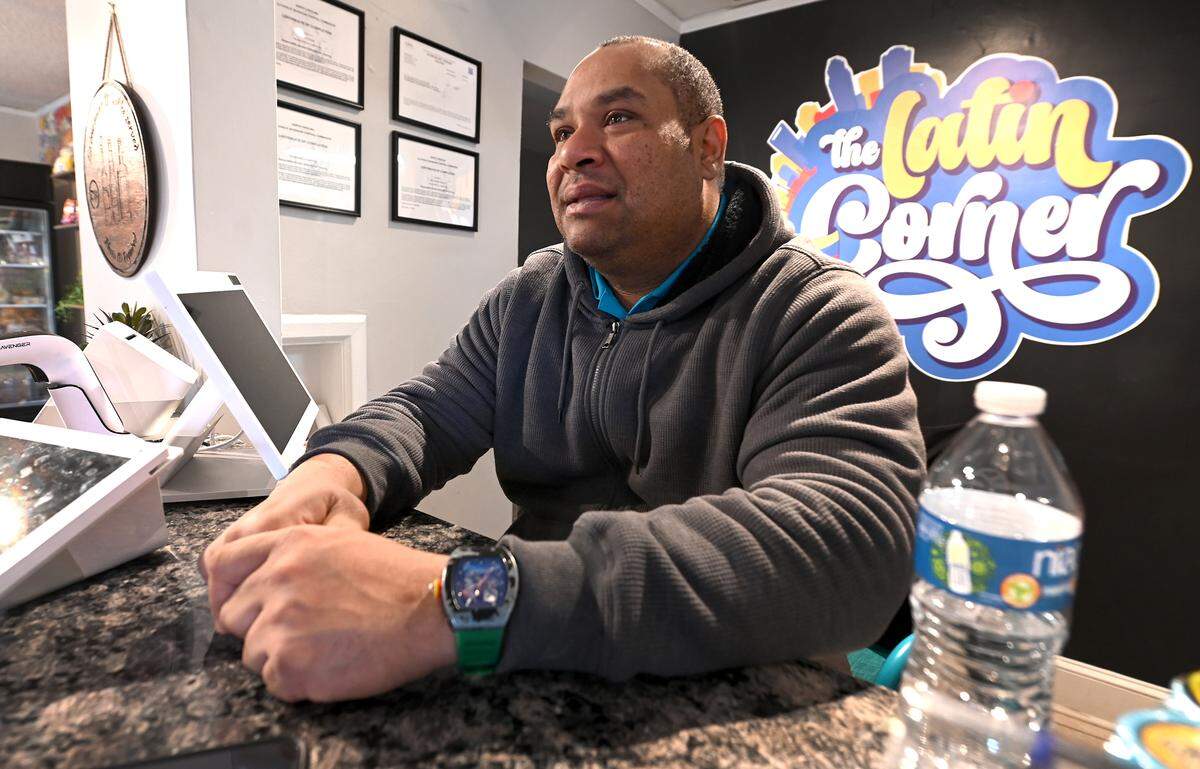 David Villanueva, co-owner of The Latin Corner in Pineville, watches news programming about ousted Venezuelan President Nicolas Maduro on Monday. Villanueva, a native of Venezuela, said he is happy after waiting 26-years for this moment. 