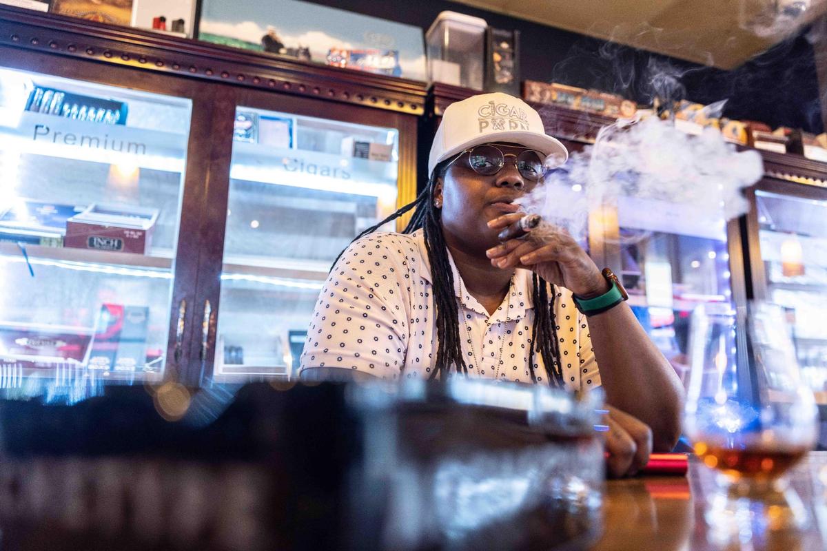Jazzmine Barriner, a cigar smoker for 14 years, has managed at Tailored Smoke for the past year and a half.