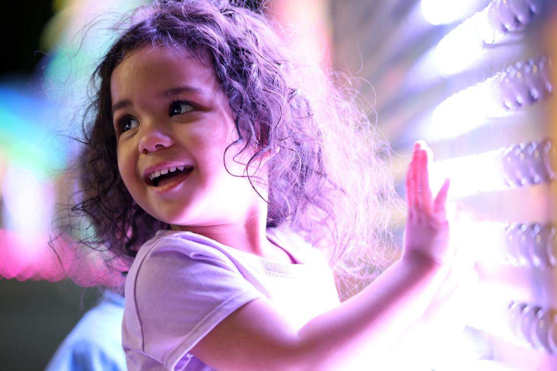 Raya Aquino, 2, enjoys “The Illuminated Playground” at the Tianyu Lights Festival at Concord Mills, Charlotte, N.C., on Friday, April 25, 2025.