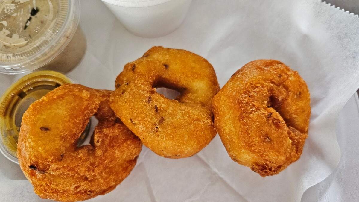Triveni’s Medu Vada are deep fried fritters made from a batter of black gram lentils and mixed with cumin and peppercorns. They’re served with chutney and sambar.
