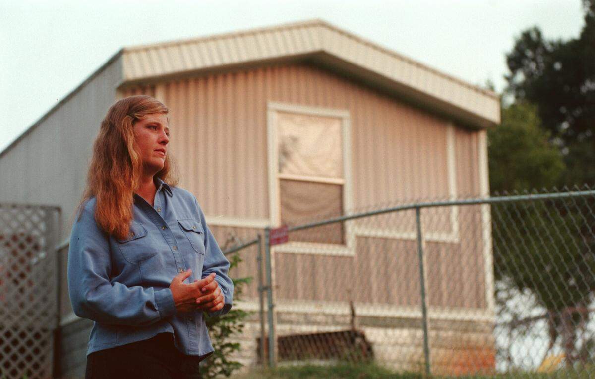 The collection case against Kelly Campbell, shown outside her mobile home near Mount Holly, NC, in 1999, will age out in December 2024.