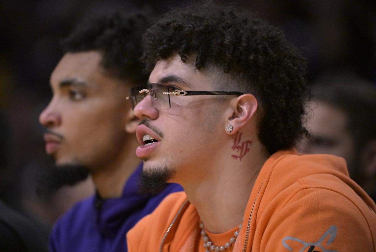 LaMelo Ball looks on from the bench in a game earlier this season.