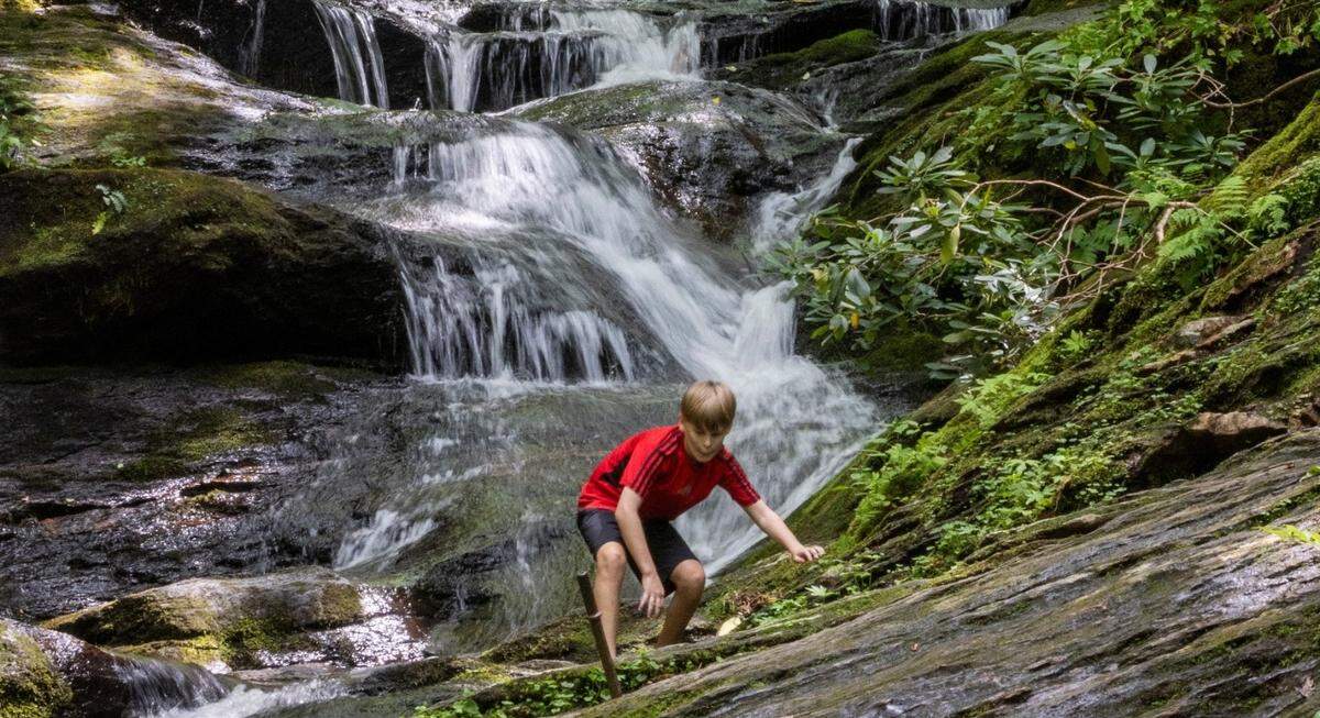 Roaring Fork Falls is a 50-foot high waterfall in the Pisgah National Forest. You’ll find it an easy three-quarter-mile hike from a small parking area off N.C. 80.