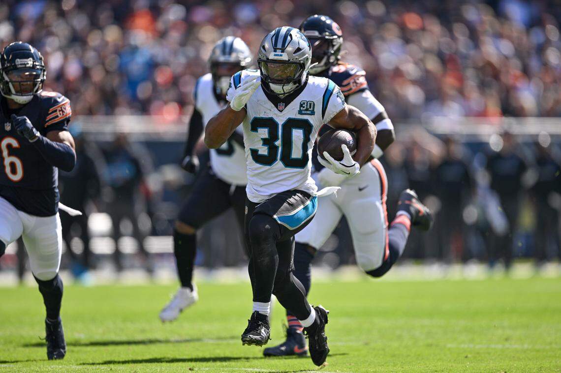 Carolina Panthers running back Chuba Hubbard (30) rushed for a touchdown against the Chicago Bears during Sunday’s first quarter at Soldier Field.