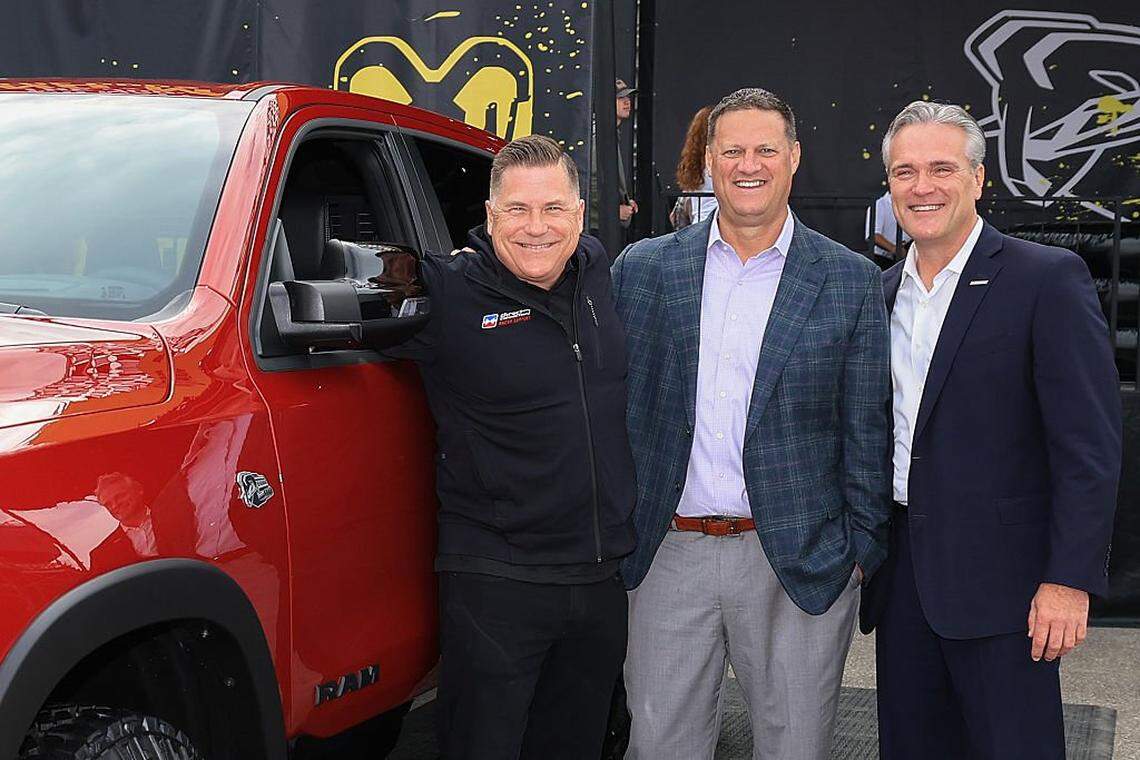 BROOKLYN, MICHIGAN - JUNE 08: (L-R) Tim Kuniskis, CEO Ram Brand - Stellantis, NASCAR Executive Vice President Steve O'Donnell and John Probst, SVP of Innovation and Racing Development pose at the Ram display on the midway for the announcement that the Ram brand will return to NASCAR Craftsman Truck Series competition, prior to the NASCAR Cup Series FireKeepers Casino 400 at Michigan International Speedway on June 08, 2025 in Brooklyn, Michigan. (Photo by Chris Graythen/Getty Images)