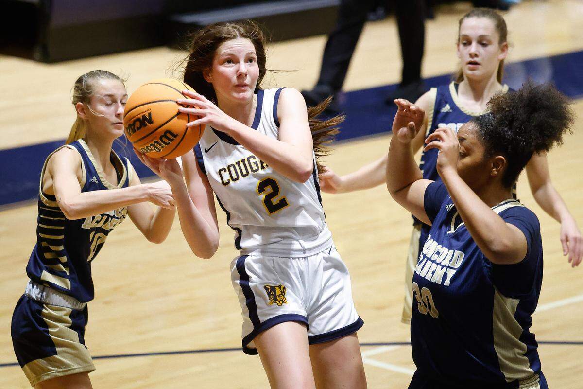 Carmel Christian’s Olivia Boyce (2) goes up against Concord Academy’s Samantha Meyers (10) and Zoey Ward (30) during a game at Carmel Christian in Matthews, N.C., Tuesday, Nov. 22, 2022.