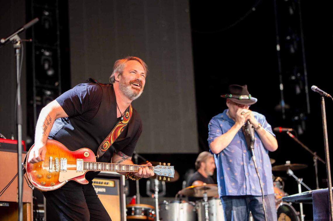 Chan Kinchla (left) jams with John Popper during Blues Traveler’s performance at Charlotte’s PNC Music Pavilion.